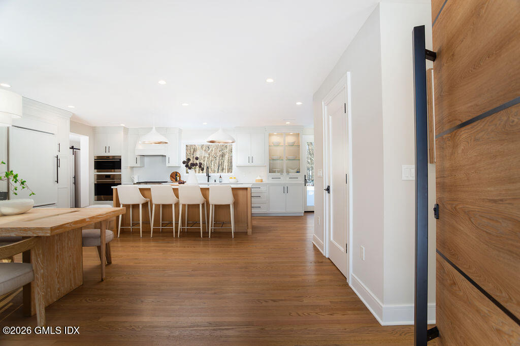 49 Salisbury Road Darien, CT 06820 - Photo 3 of 40 a large room with dining room and chandelier