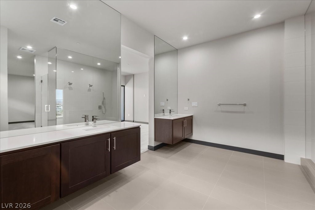 36 Rainbow Point Place Henderson, NV 89011 - Photo 19 of 34 Primary Bathroom| Shower with Bench| Dual Vanities|Dual Water Rooms|Large Closet