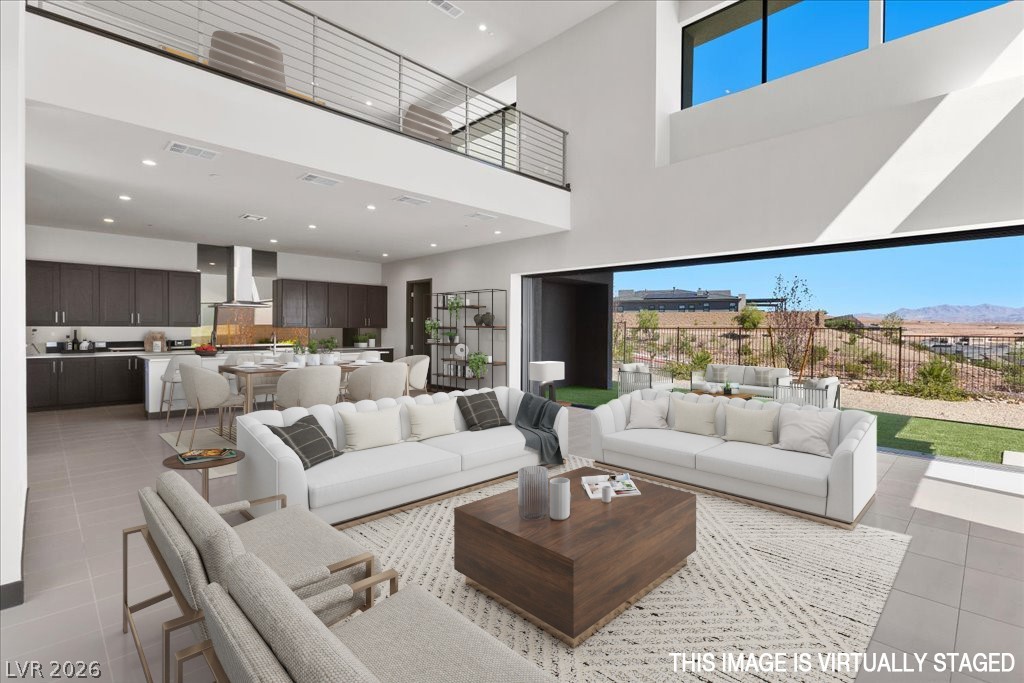 36 Rainbow Point Place Henderson, NV 89011 - Photo 5 of 34 Living Room|Dining Area|Pocket Doors| Linear Fireplace