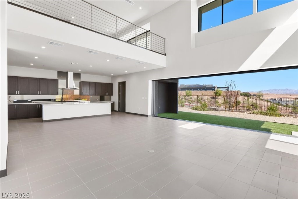 36 Rainbow Point Place Henderson, NV 89011 - Photo 6 of 34 Living Room|Dining Area|Pocket Doors| Linear Fireplace