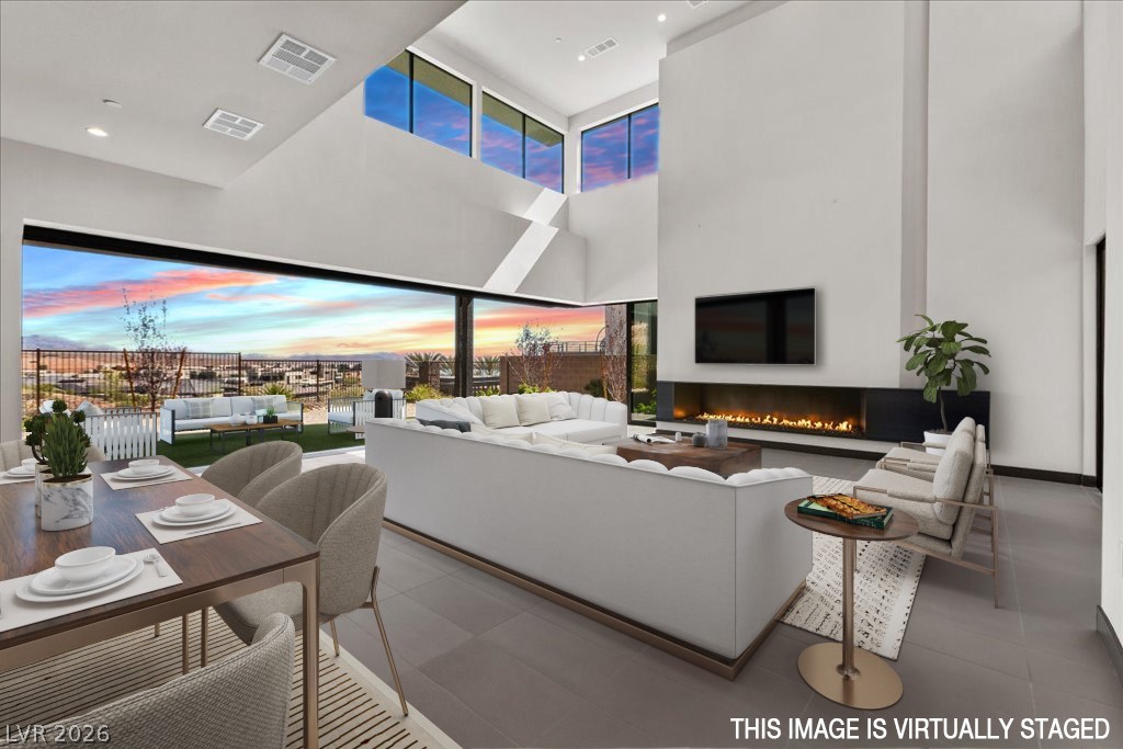 36 Rainbow Point Place Henderson, NV 89011 - Photo 7 of 34 Living Room|Dining Area|Pocket Doors| Linear Fireplace