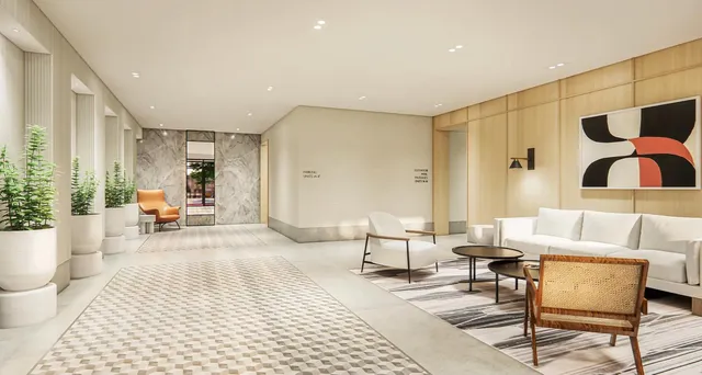 a living room with furniture and lamp