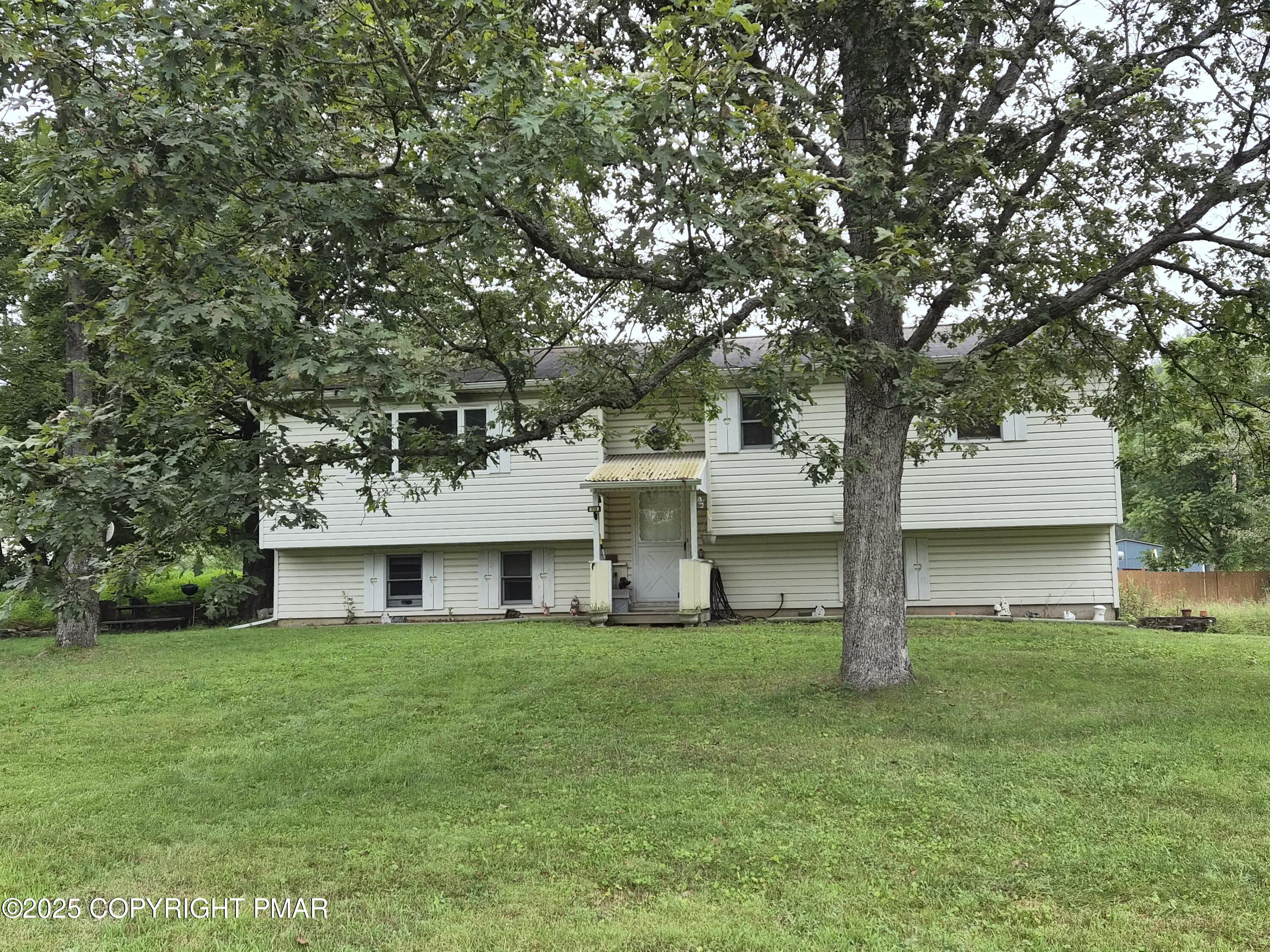 113 Olsen Road Stroudsburg, PA 18360 - Photo 1 of 22 a front view of house with yard and tree