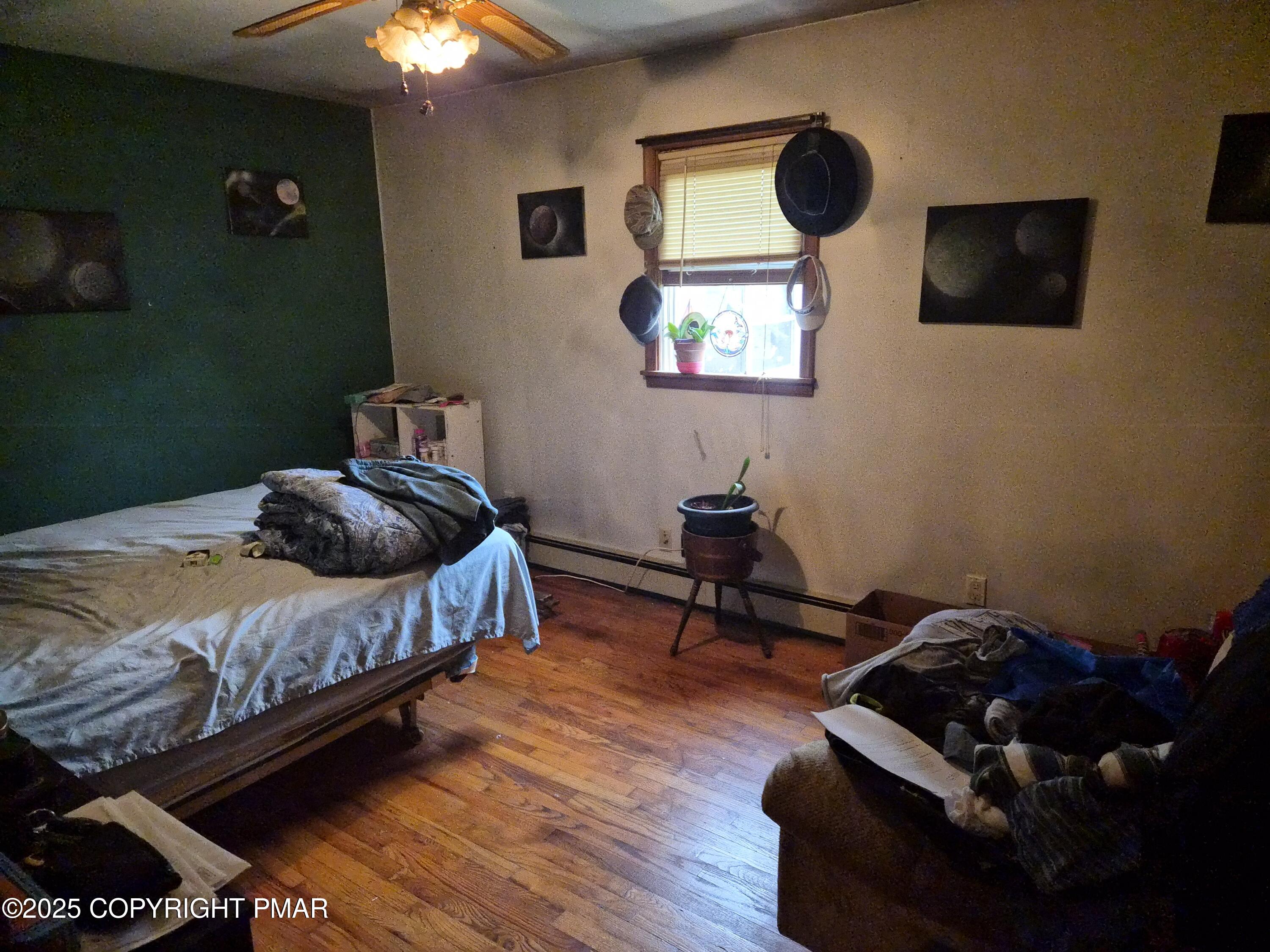 113 Olsen Road Stroudsburg, PA 18360 - Photo 11 of 22 a bedroom with a bed and a flat tv screen on dresser