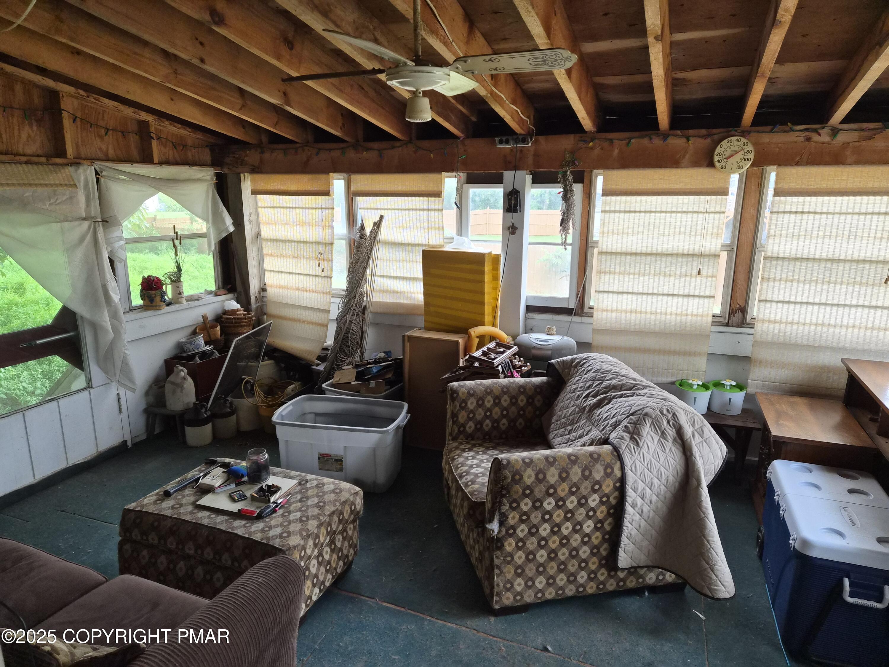 113 Olsen Road Stroudsburg, PA 18360 - Photo 13 of 22 a living room with furniture and a large window