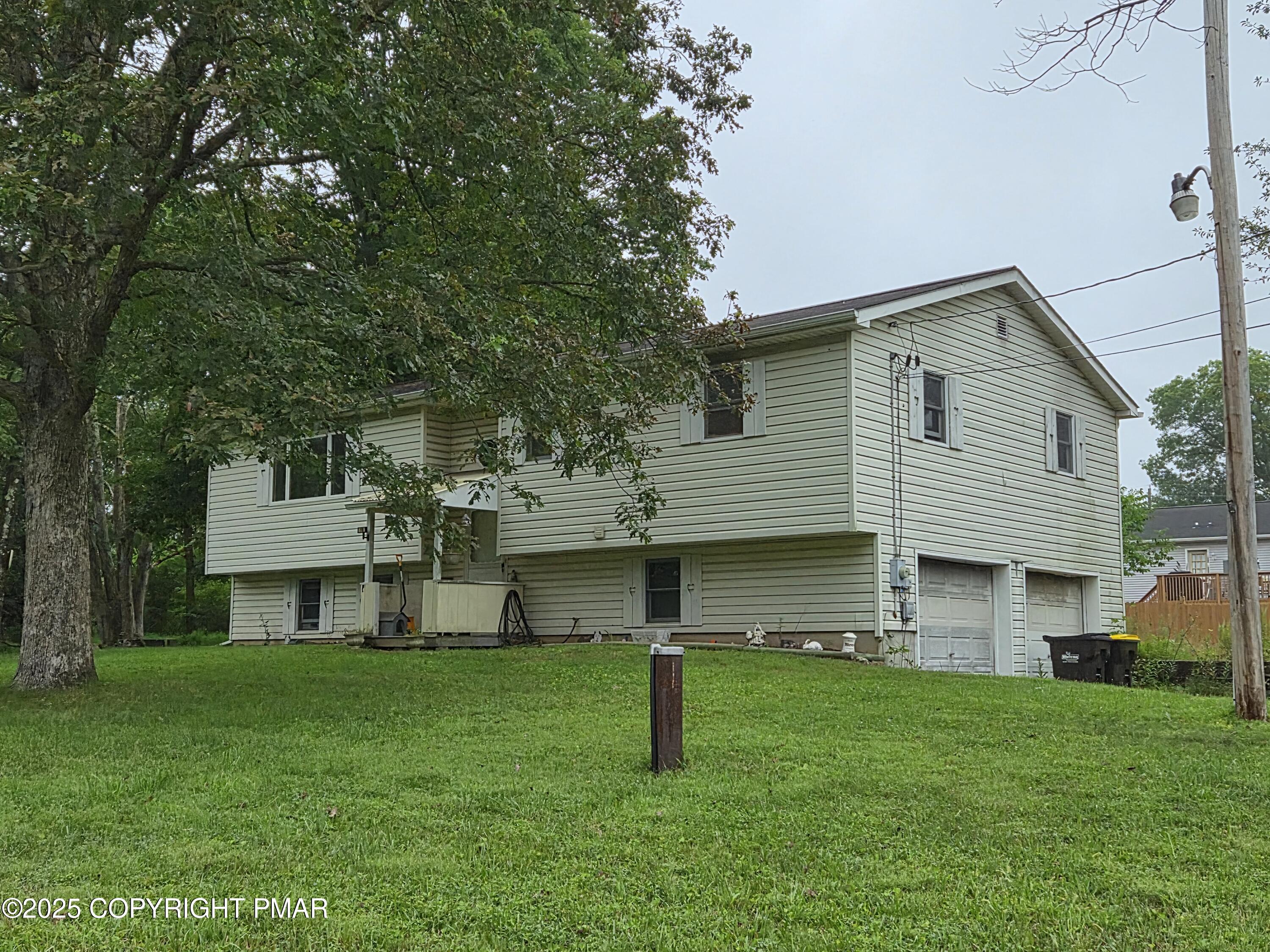 113 Olsen Road Stroudsburg, PA 18360 - Photo 21 of 22 a front view of a house with a yard