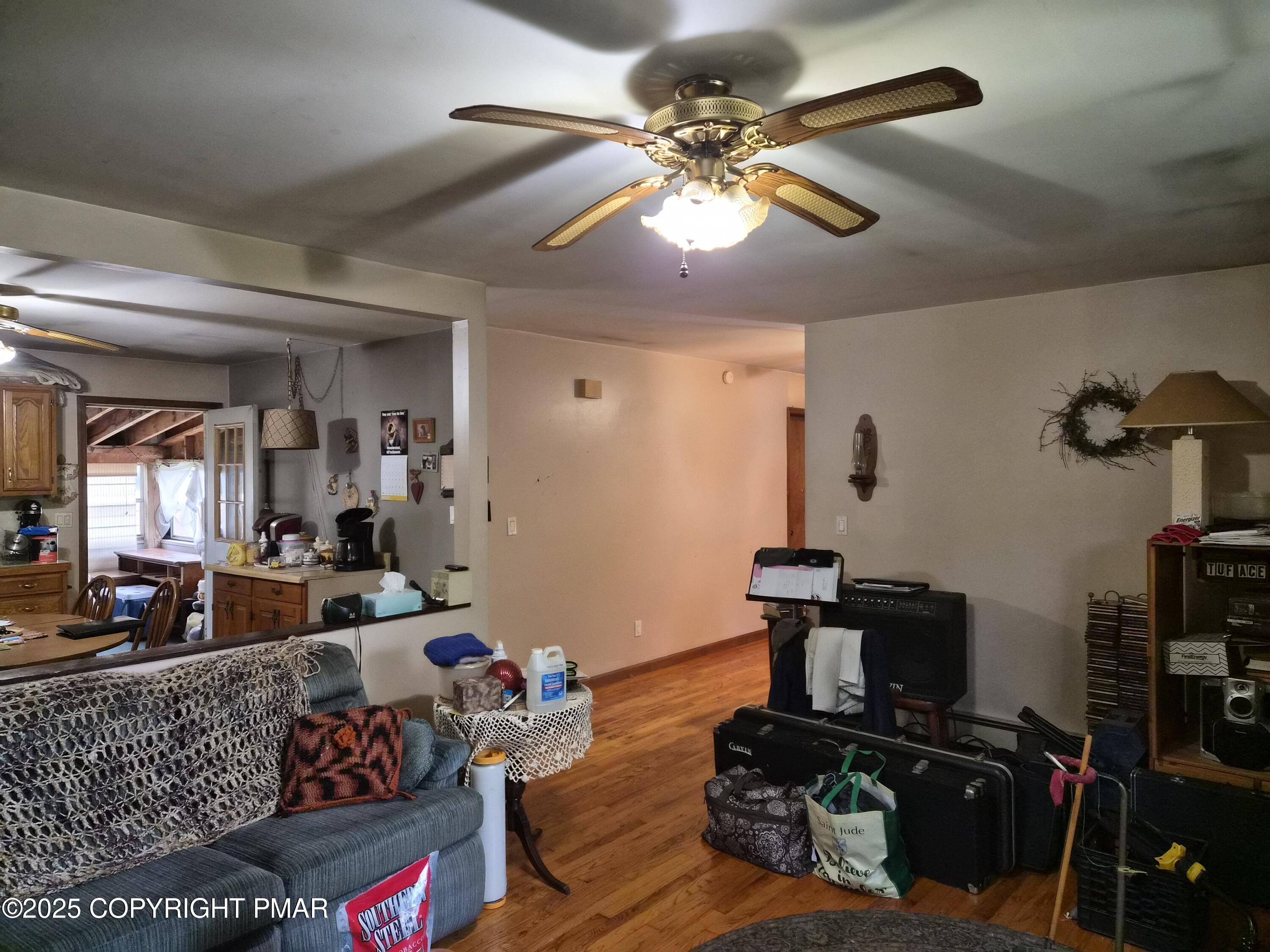 113 Olsen Road Stroudsburg, PA 18360 - Photo 5 of 22 a living room with furniture and stairs