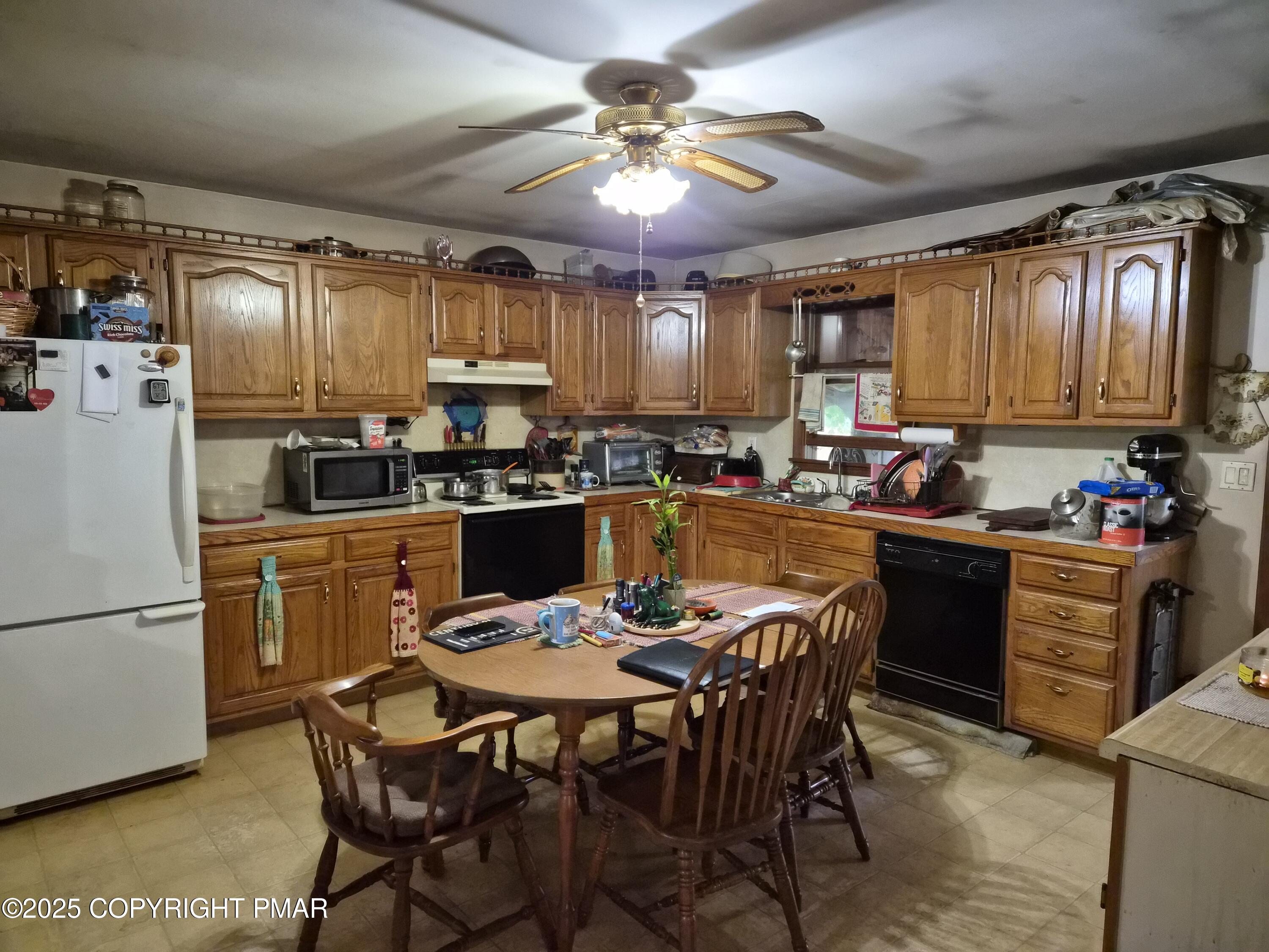 113 Olsen Road Stroudsburg, PA 18360 - Photo 8 of 22 a kitchen with a dining table and chairs
