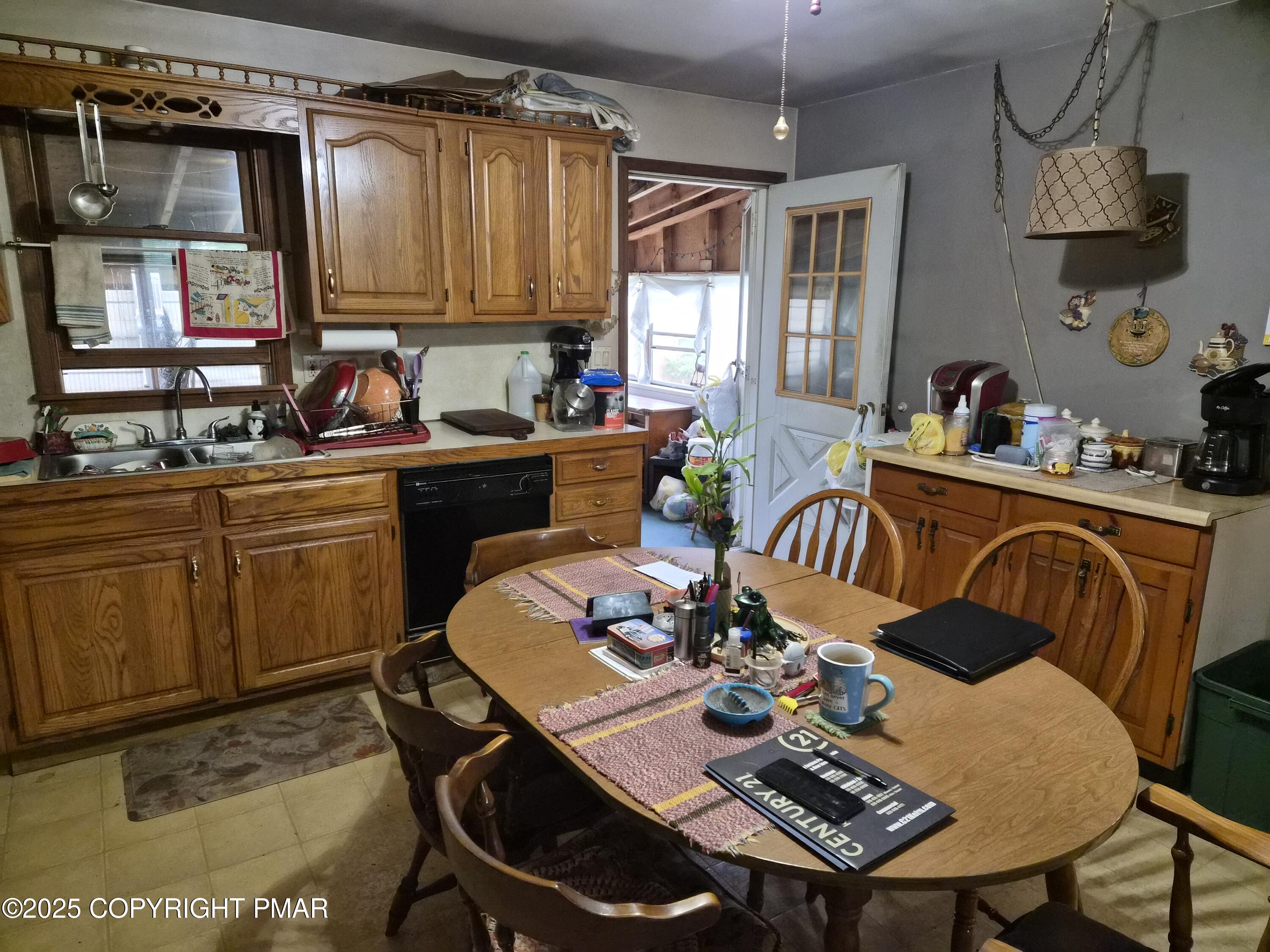 113 Olsen Road Stroudsburg, PA 18360 - Photo 9 of 22 a kitchen with a dining table chairs and a dining table