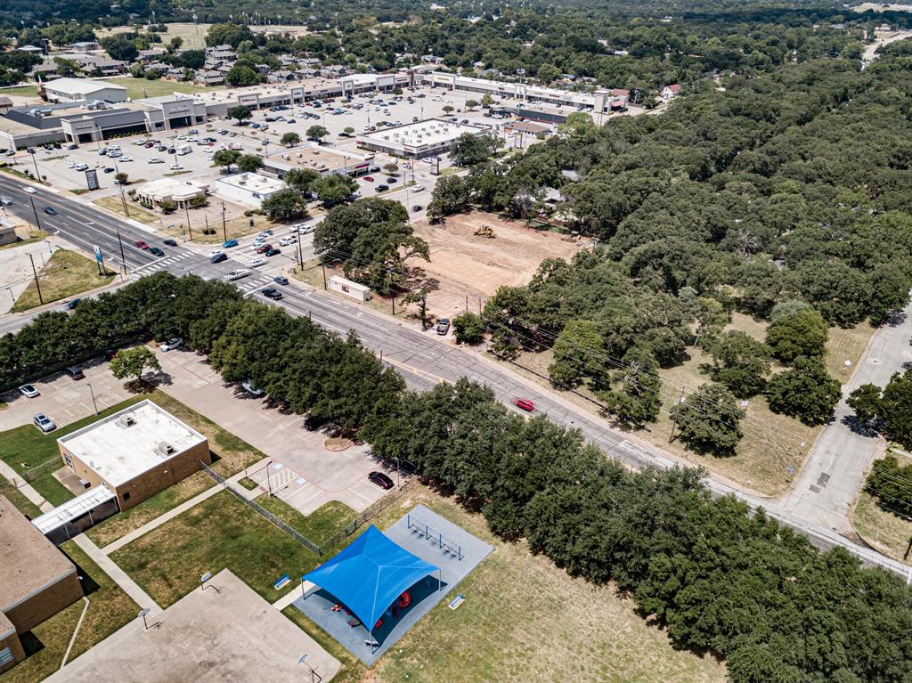 1525 West Randol Mill Road Arlington, TX 76012 - Photo 2 of 8 an aerial view of residential houses with outdoor space