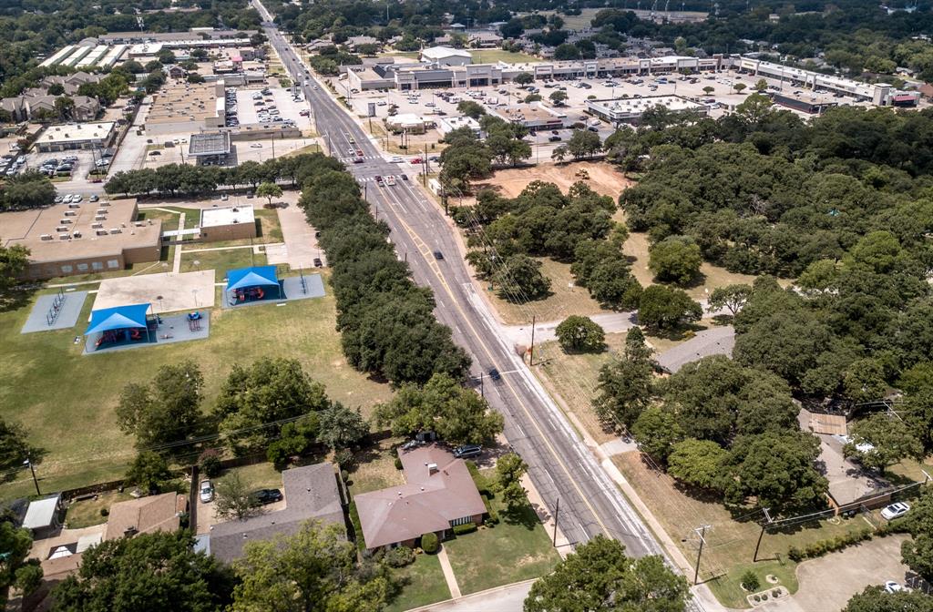 1525 West Randol Mill Road Arlington, TX 76012 - Photo 5 of 8 an aerial view of residential houses with outdoor space