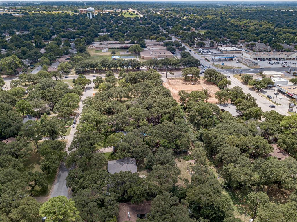 1525 West Randol Mill Road Arlington, TX 76012 - Photo 7 of 8 an aerial view of residential houses with outdoor space
