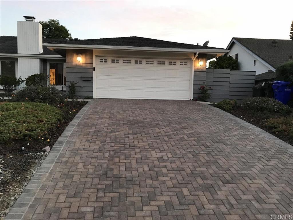 a front view of house with a yard