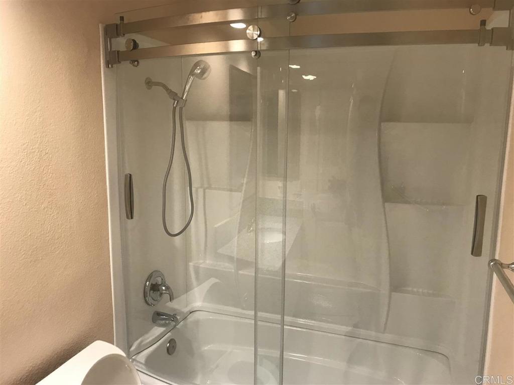 11417 Poblado Road San Diego, CA 92127 - Photo 15 of 37 a bathroom with a shower and a bathtub