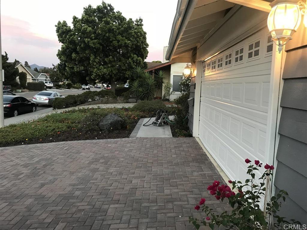 11417 Poblado Road San Diego, CA 92127 - Photo 26 of 37 a view of a house with a yard