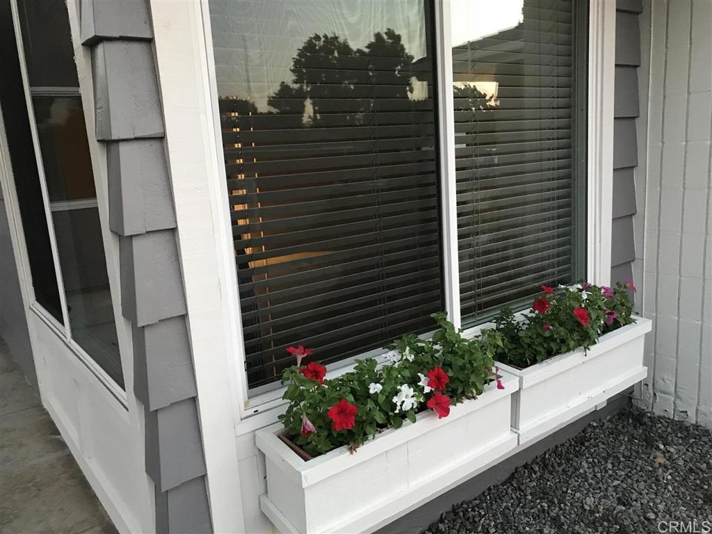 11417 Poblado Road San Diego, CA 92127 - Photo 27 of 37 a view of a flower garden in front of a door