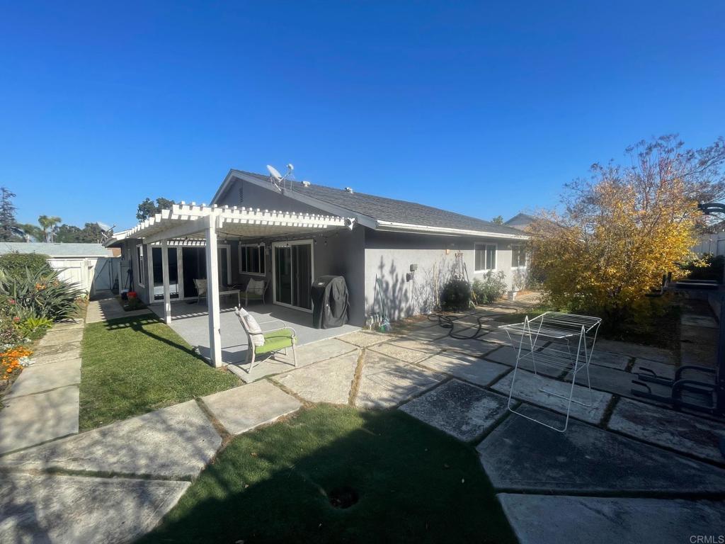 11417 Poblado Road San Diego, CA 92127 - Photo 31 of 37 a view of a house with backyard porch and sitting area