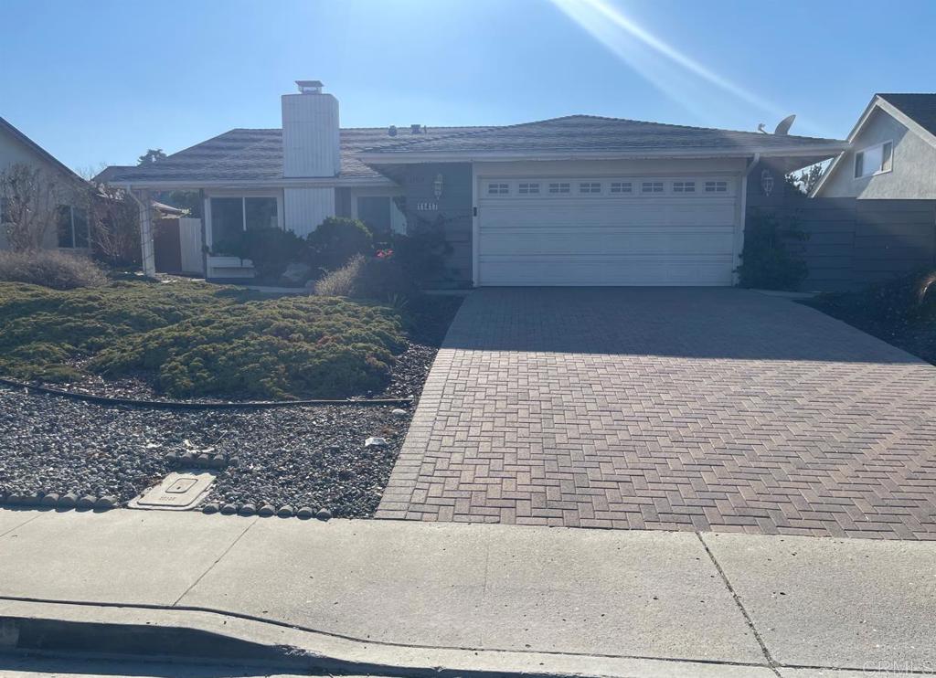 11417 Poblado Road San Diego, CA 92127 - Photo 37 of 37 a view of a brick house with many windows