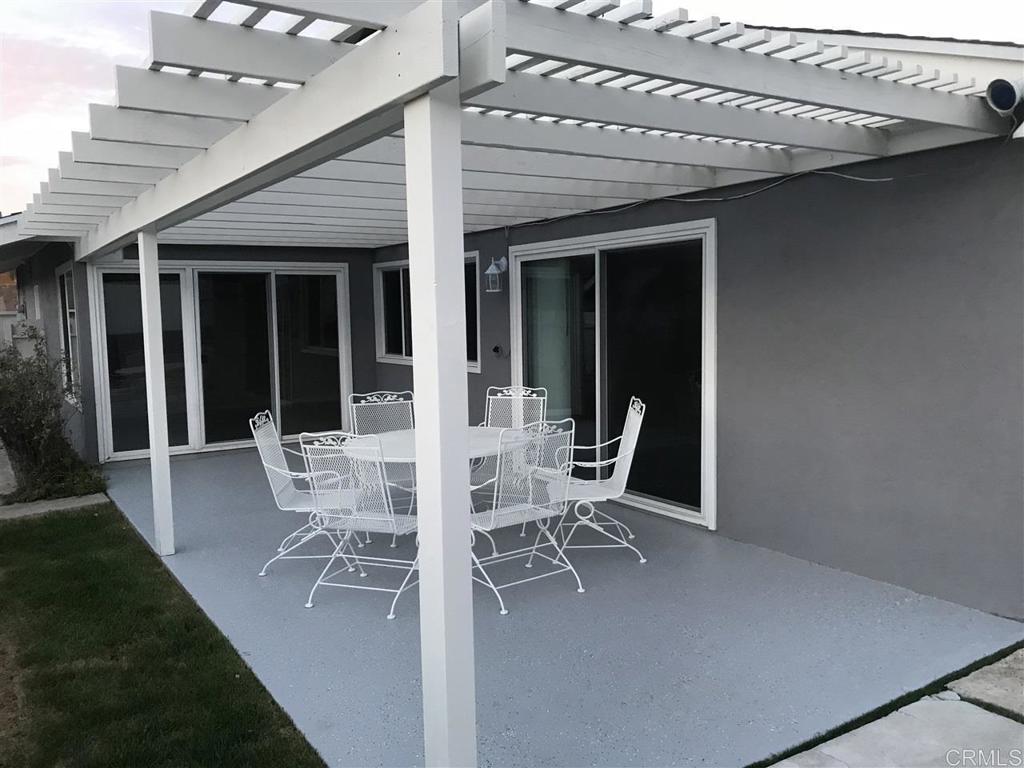 11417 Poblado Road San Diego, CA 92127 - Photo 5 of 37 a view of a patio with table and chairs and potted plants