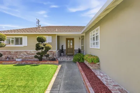 a front view of a house with garden