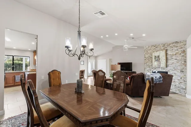 a kitchen with granite countertop stainless steel appliances and wooden cabinets