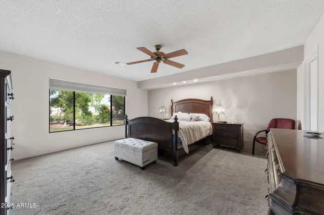 a bedroom with two beds and a window