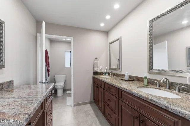 a bed room with a bed and a chandelier