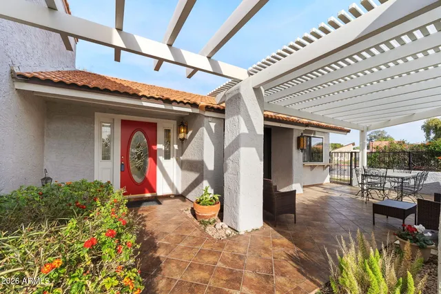 a outdoor living space with patio furniture and garden view