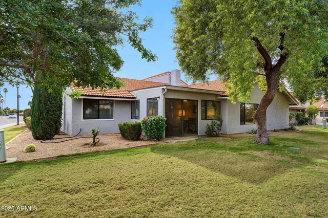 a view of a big yard with an outdoor space and seating