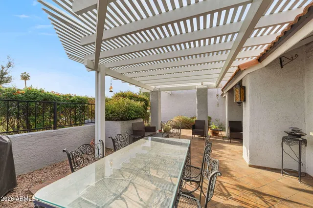 a view of a dining area with furniture window and kitchen view