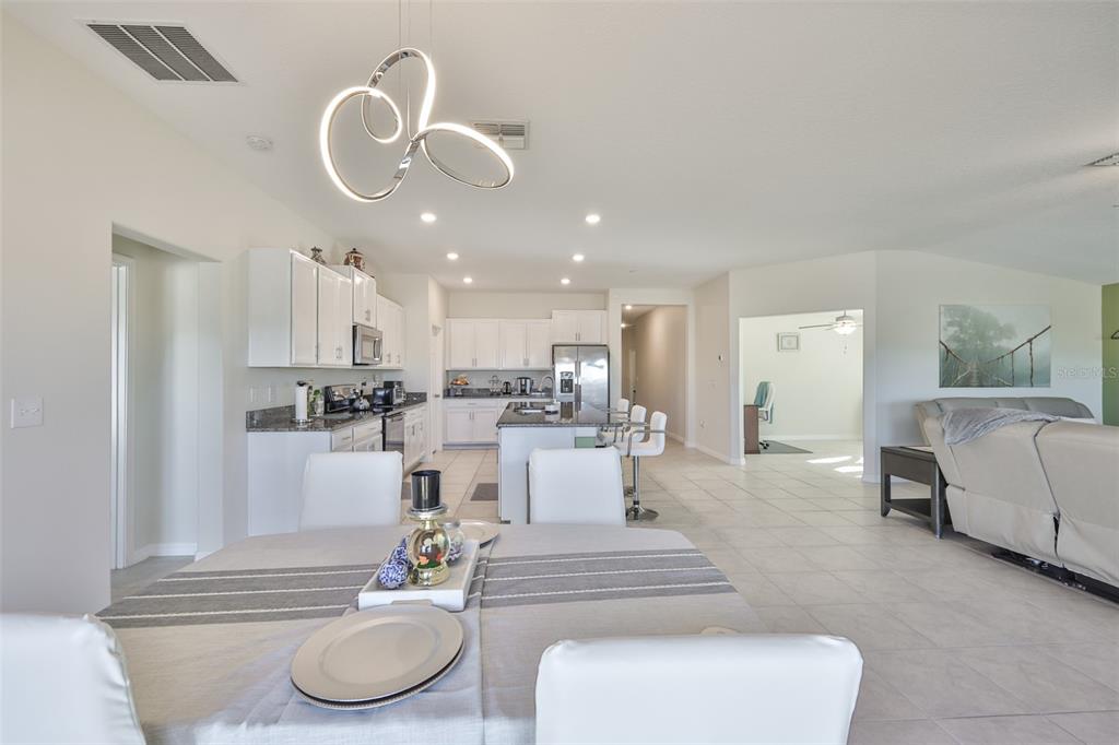 13575 Willow Bluestar Loop Riverview, FL 33579 - Photo 13 of 48 a living room with furniture and kitchen view