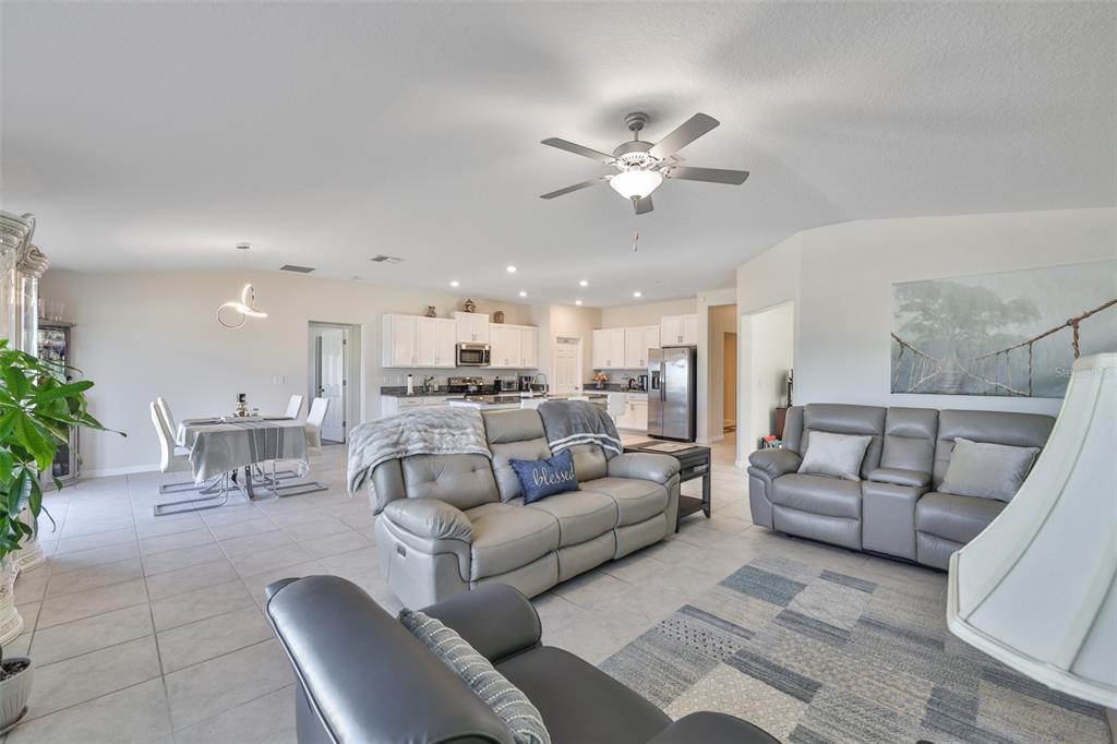 13575 Willow Bluestar Loop Riverview, FL 33579 - Photo 16 of 48 a living room with furniture and a view of kitchen