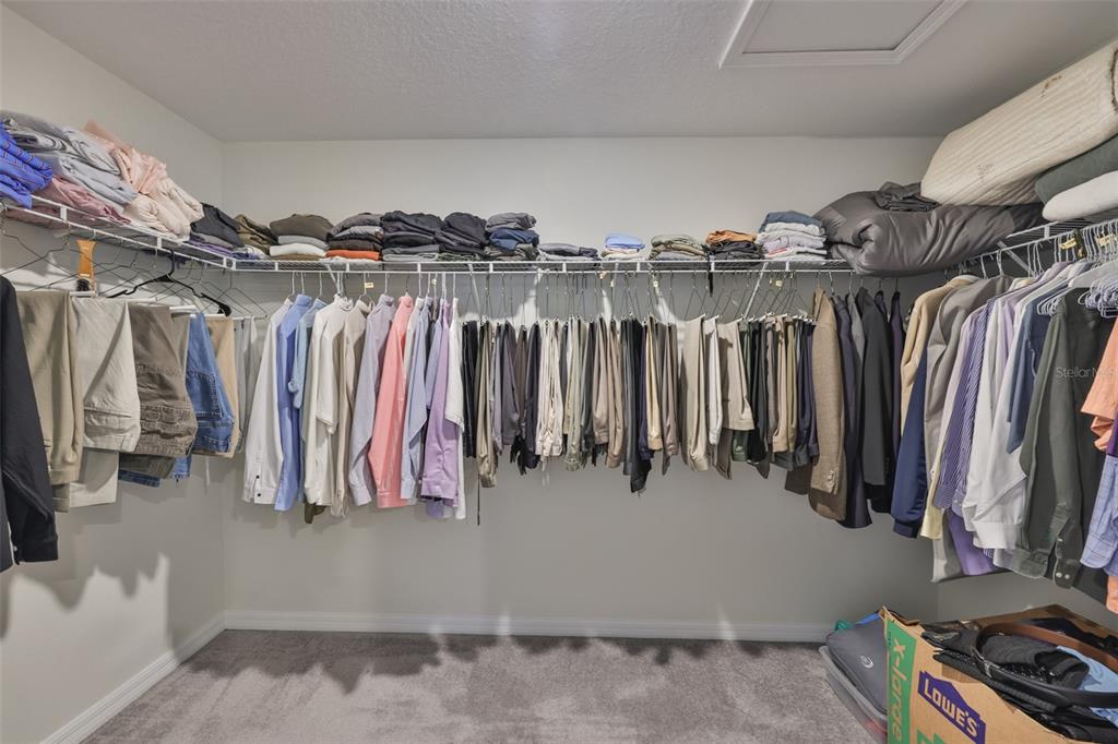 13575 Willow Bluestar Loop Riverview, FL 33579 - Photo 24 of 48 a view of walk in closet with clothes and shoes