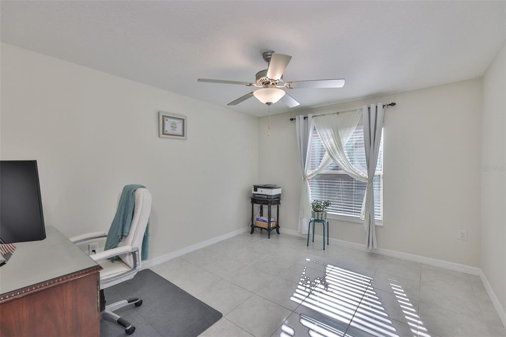 13575 Willow Bluestar Loop Riverview, FL 33579 - Photo 25 of 48 a view of a workspace with furniture and a window