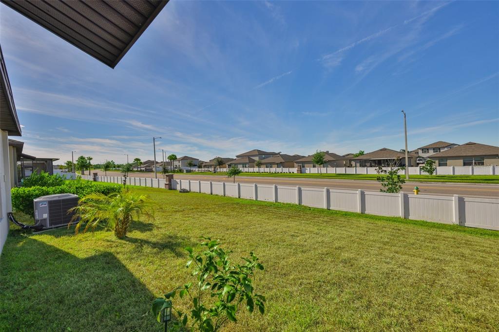 13575 Willow Bluestar Loop Riverview, FL 33579 - Photo 39 of 48 a view of a lake with a big yard