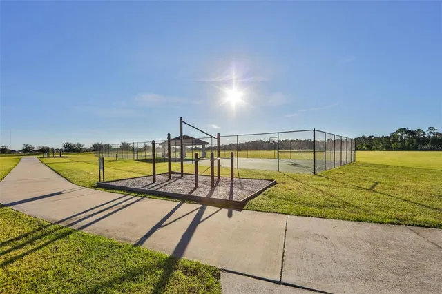a view of a street with a building in the background
