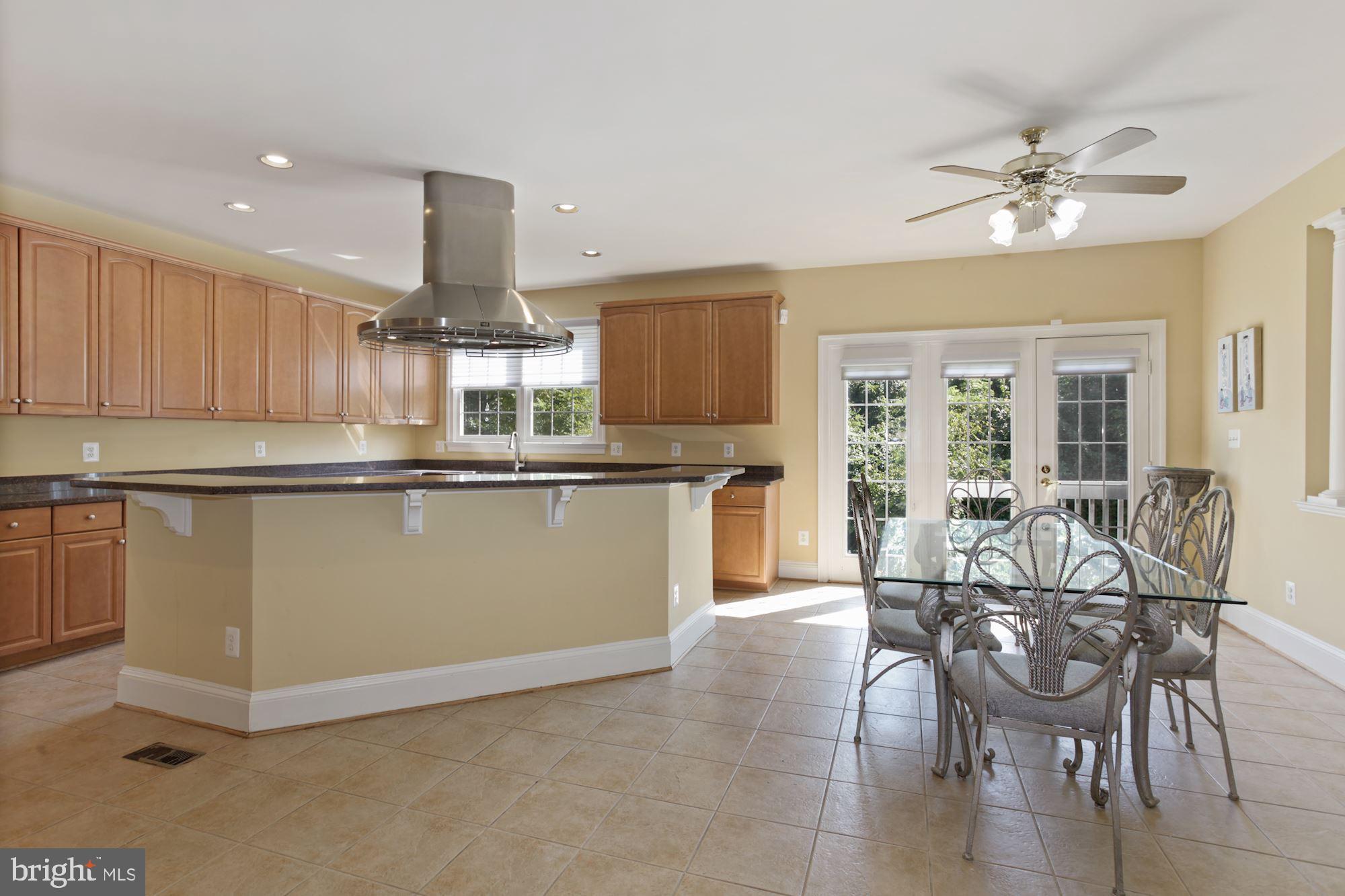 12830 Victory Lakes Loop Bristow, VA 20136 - Photo 12 of 50 Large space for a Kitchen Table.