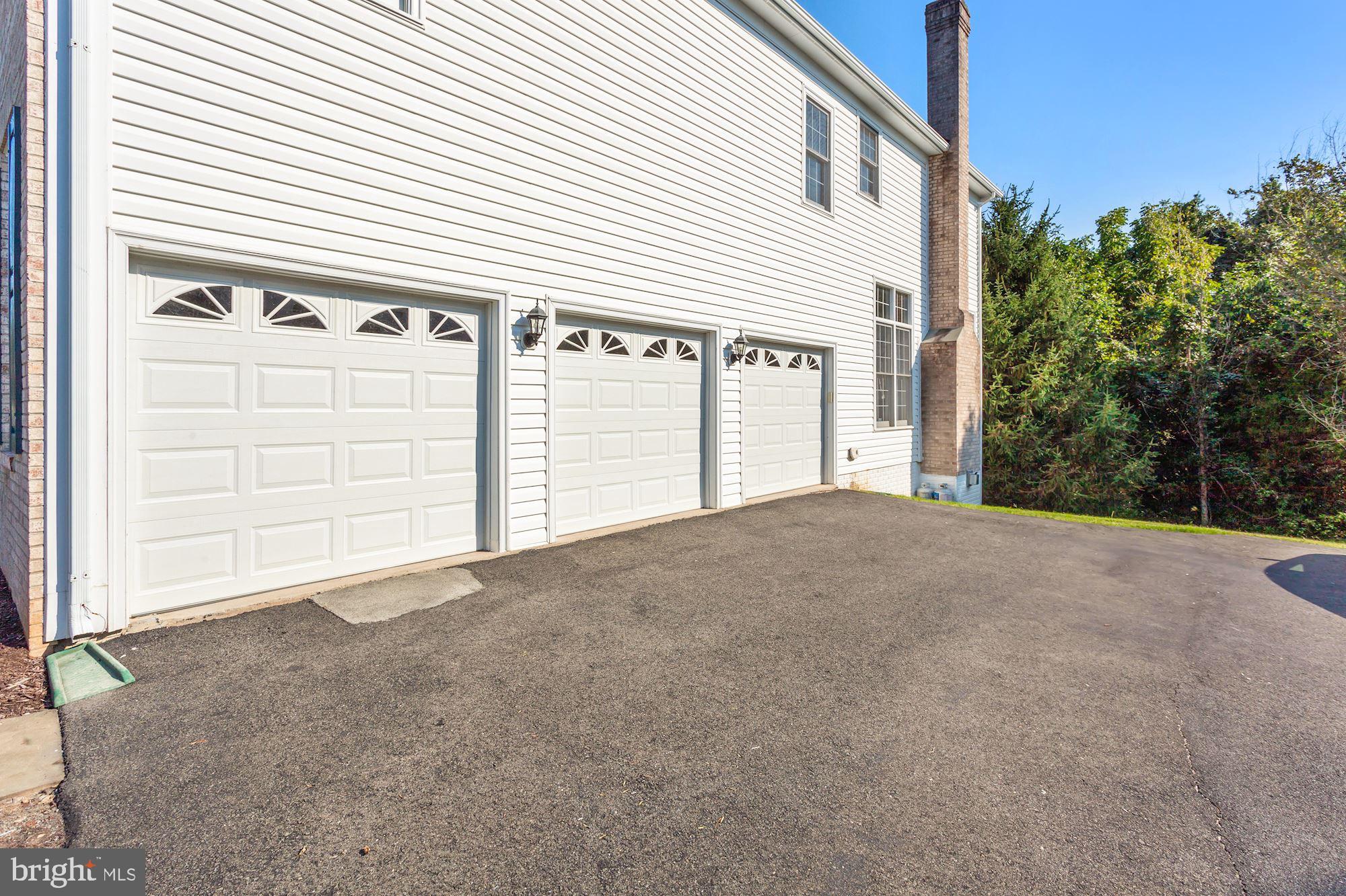 12830 Victory Lakes Loop Bristow, VA 20136 - Photo 46 of 50 THREE CAR GARAGE!
