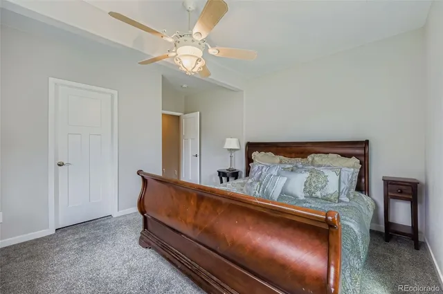 a room with a bed and a chandelier