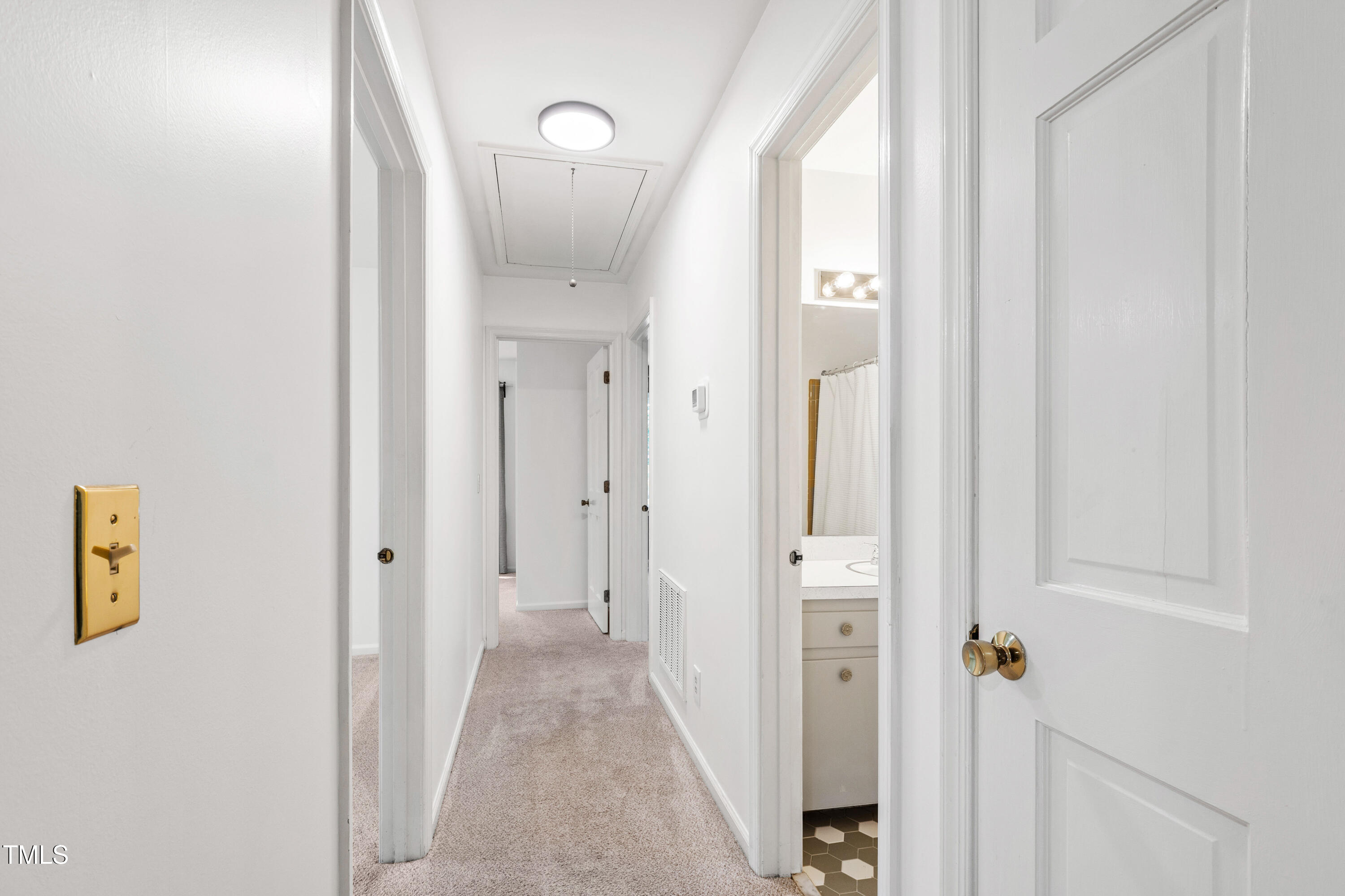 4606 Greenbrier Road Raleigh, NC 27603 - Photo 21 of 49 a view of a hallway with wooden floor and closet area