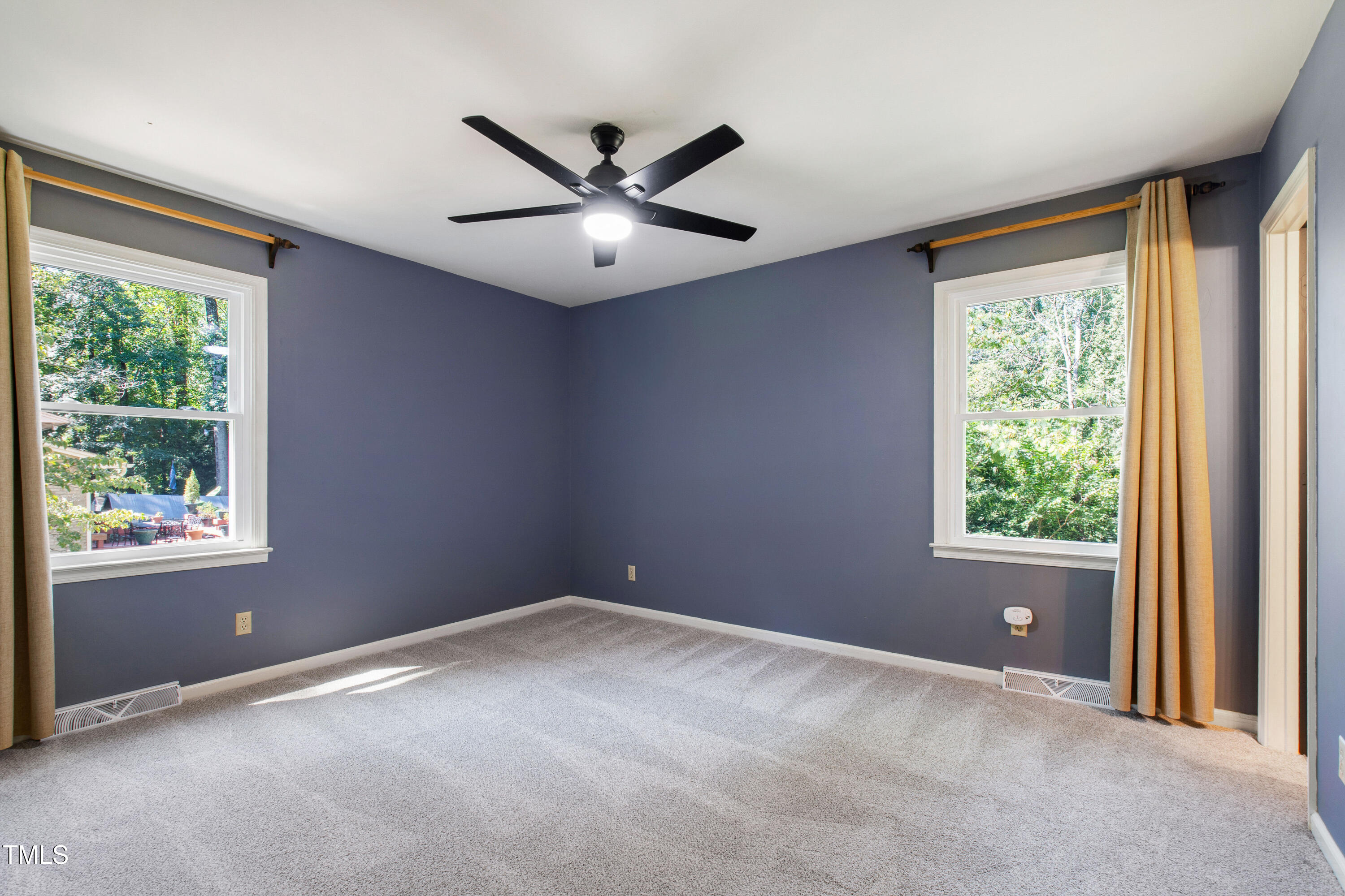 4606 Greenbrier Road Raleigh, NC 27603 - Photo 22 of 49 an empty room with windows and closet