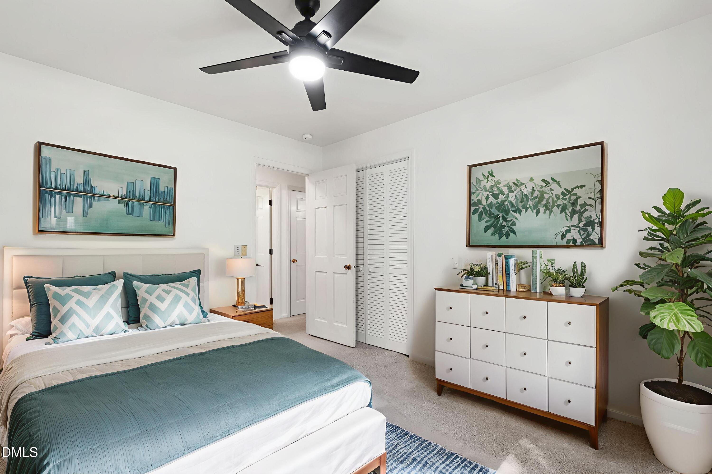 4606 Greenbrier Road Raleigh, NC 27603 - Photo 30 of 49 a bedroom with a bed and a dresser in it