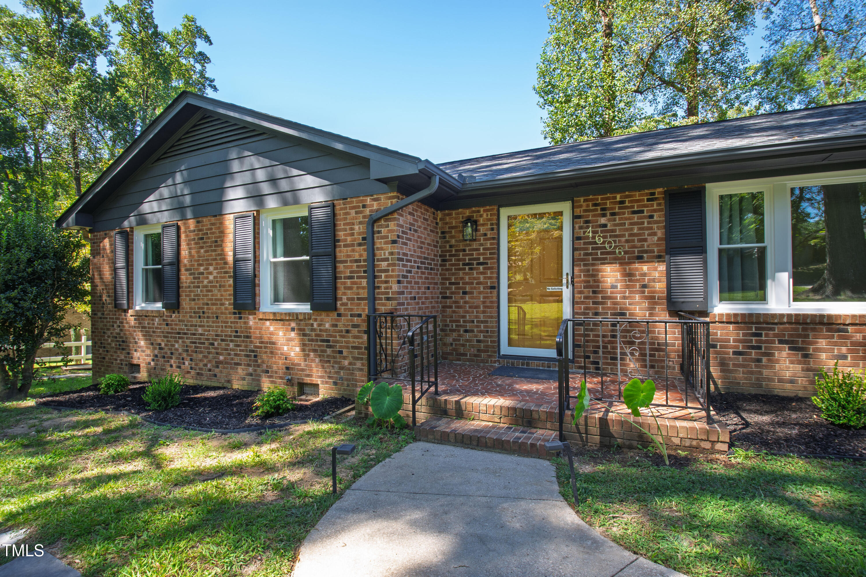 4606 Greenbrier Road Raleigh, NC 27603 - Photo 3 of 49 a front view of a house with garden