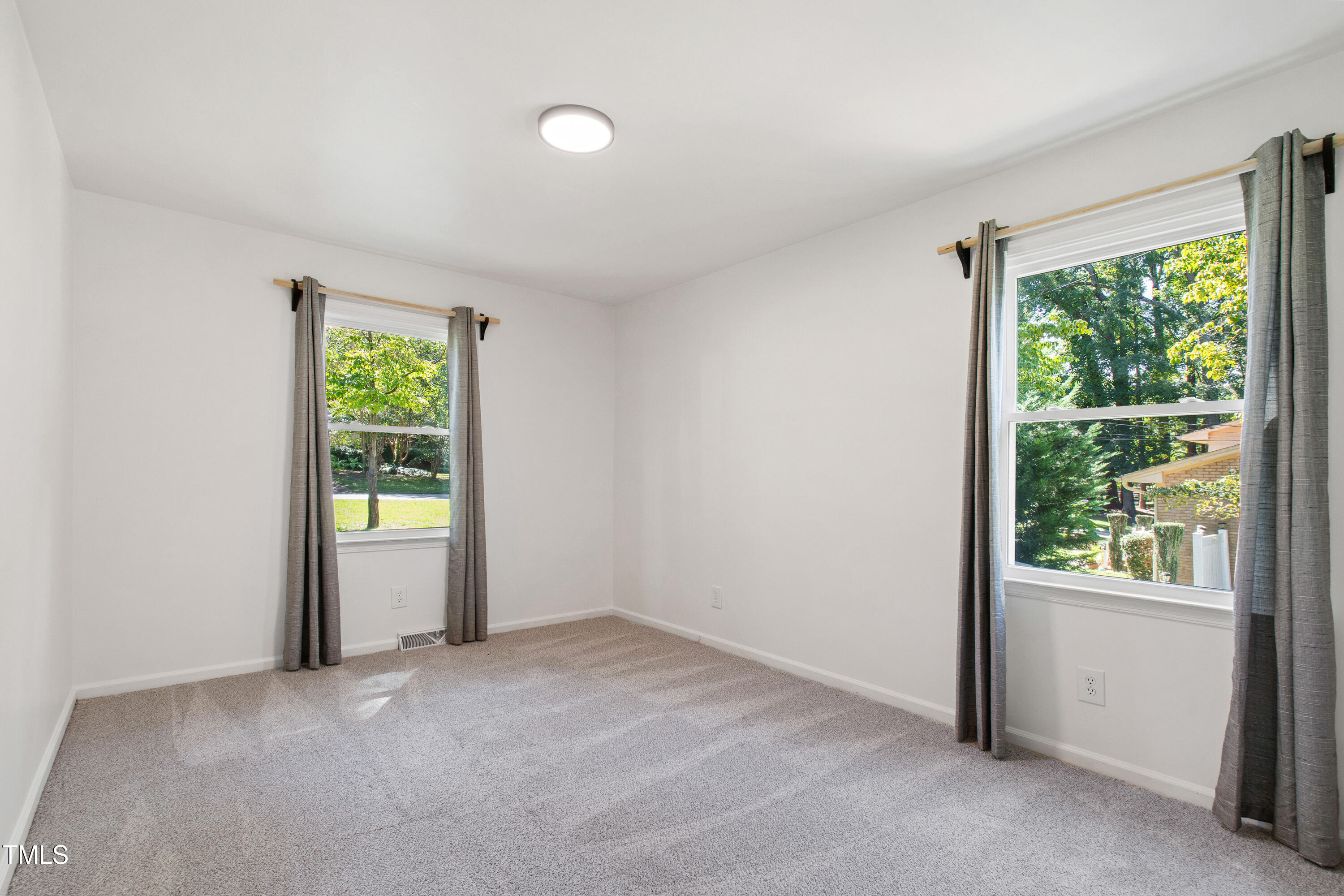 4606 Greenbrier Road Raleigh, NC 27603 - Photo 31 of 49 an empty room with windows and closet