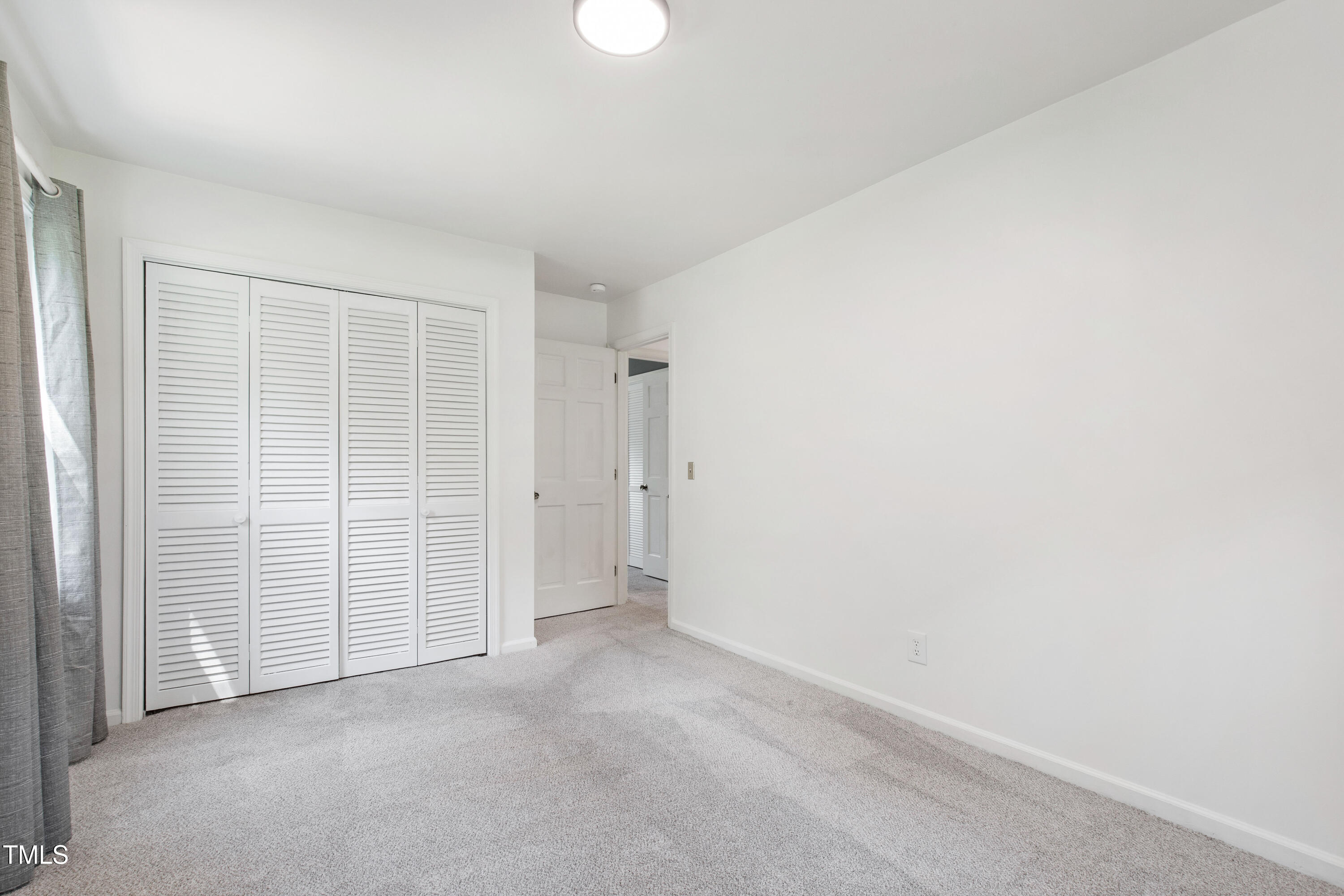 4606 Greenbrier Road Raleigh, NC 27603 - Photo 33 of 49 an empty room with closet area