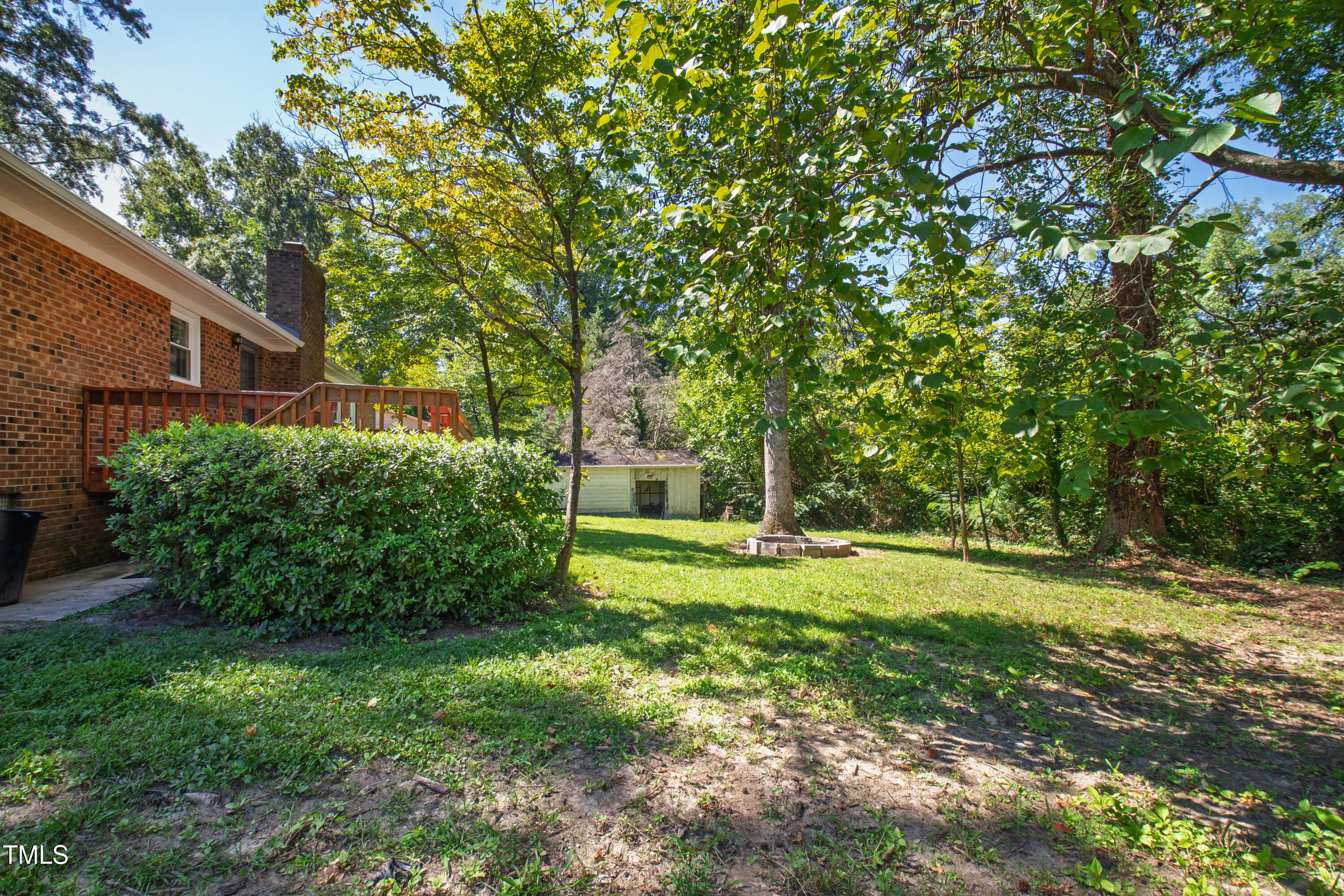 4606 Greenbrier Road Raleigh, NC 27603 - Photo 41 of 49 a view of a backyard with plants and large trees