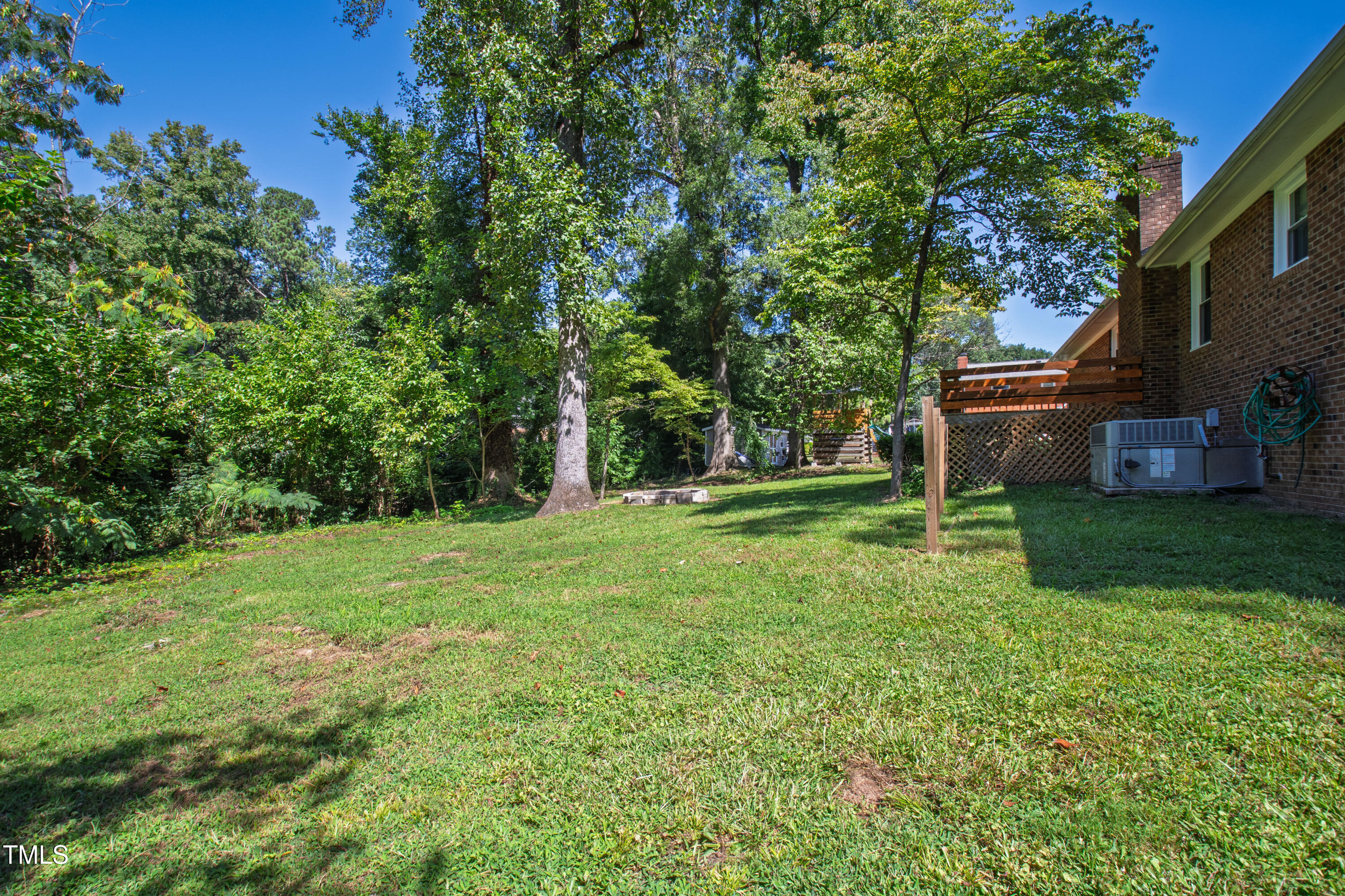 4606 Greenbrier Road Raleigh, NC 27603 - Photo 43 of 49 a view of a house with backyard and a tree