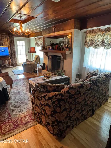 a room with wooden floor and furniture