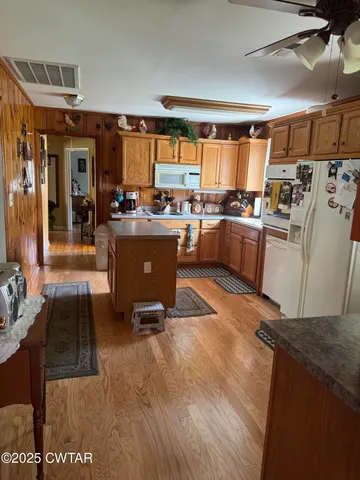 a bathroom with a sink mirror and a shower