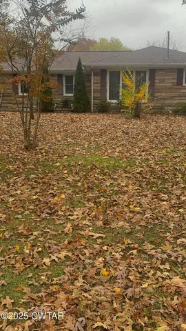 a front view of a house with yard